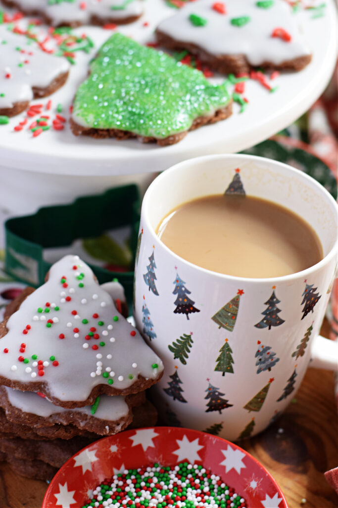 Christmas tree shortbread cookies with a cup of coffee.