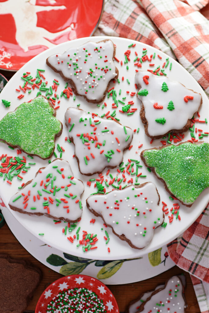 Christmas tree shortbread on a white plate.