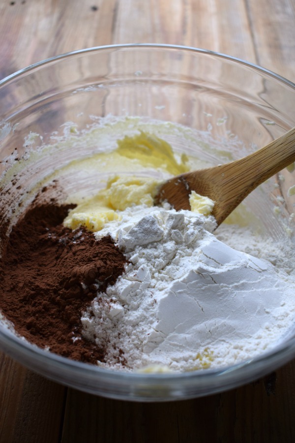 Making chocolate shortbread cookies in a bowl.