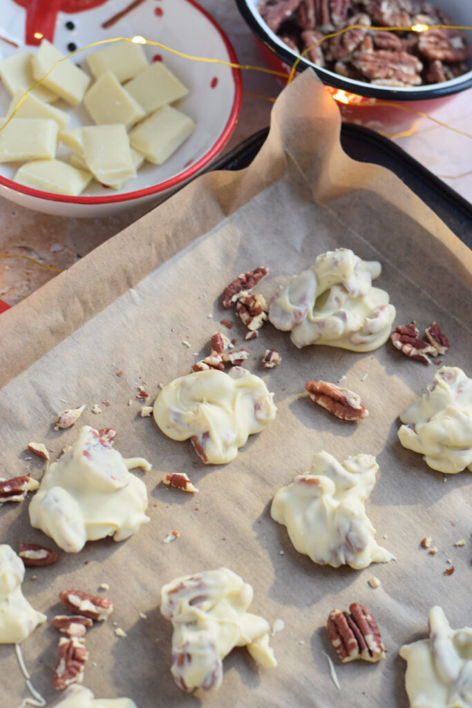 White chocolates on a baking tray.