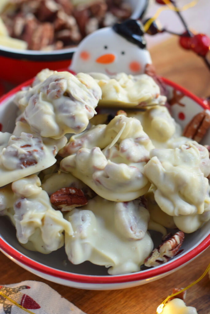 Close up of white chocolate pecan treats.