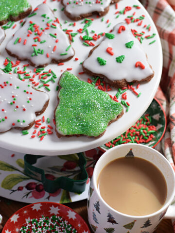 Christmas tree shortbread on a white plate.