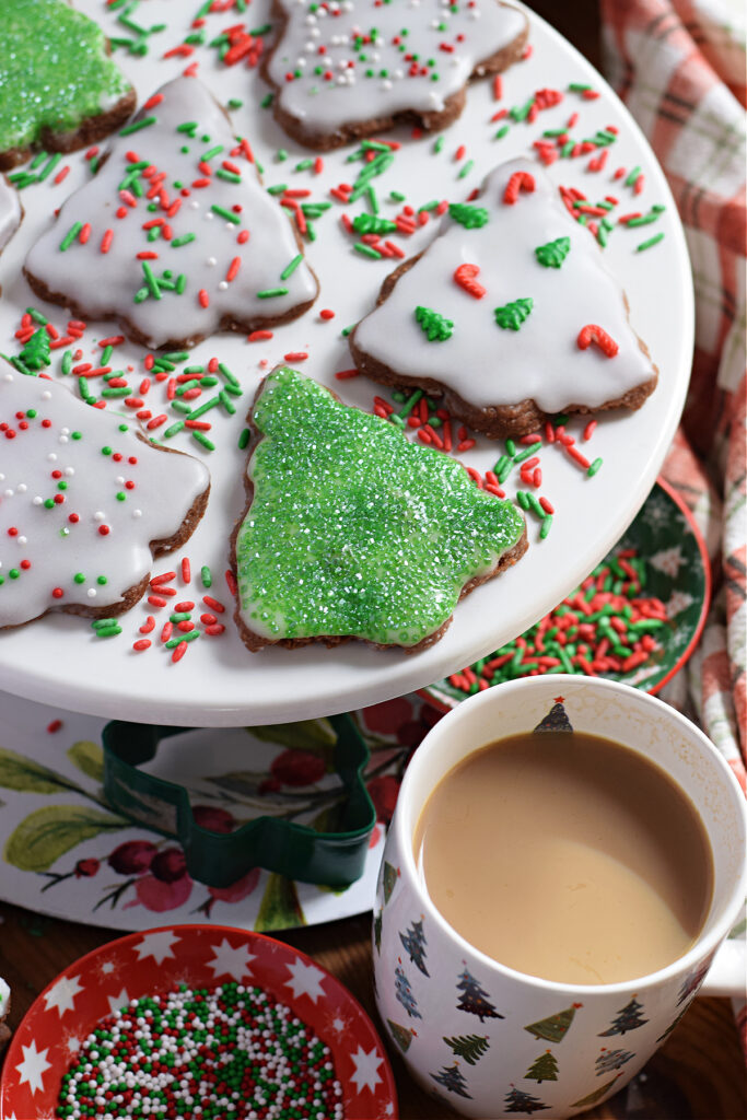 Christmas tree shortbread on a white plate.