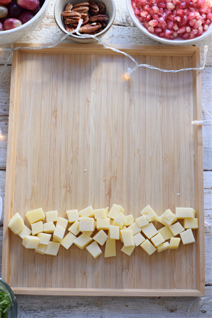 Making a fruit and cheese board.