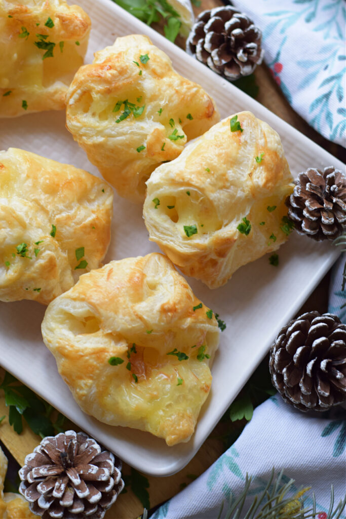 Close up of apple and brie puff pastry bites.