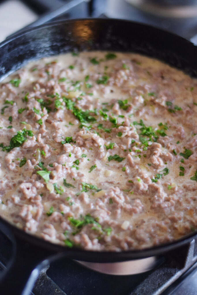 Ground beef stroganoff in a skillet.