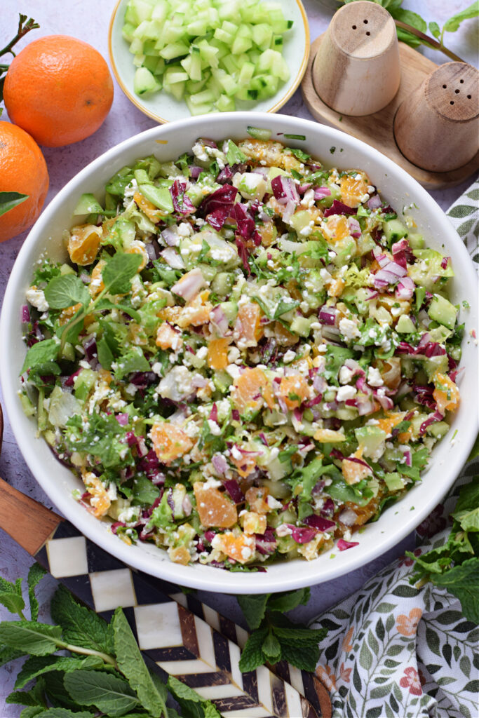 Chopped citrus salad in a white serving bowl.