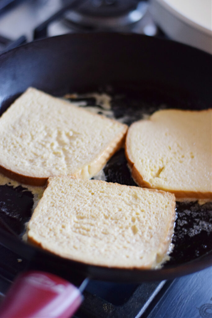 Cooking french toast in a skillet.