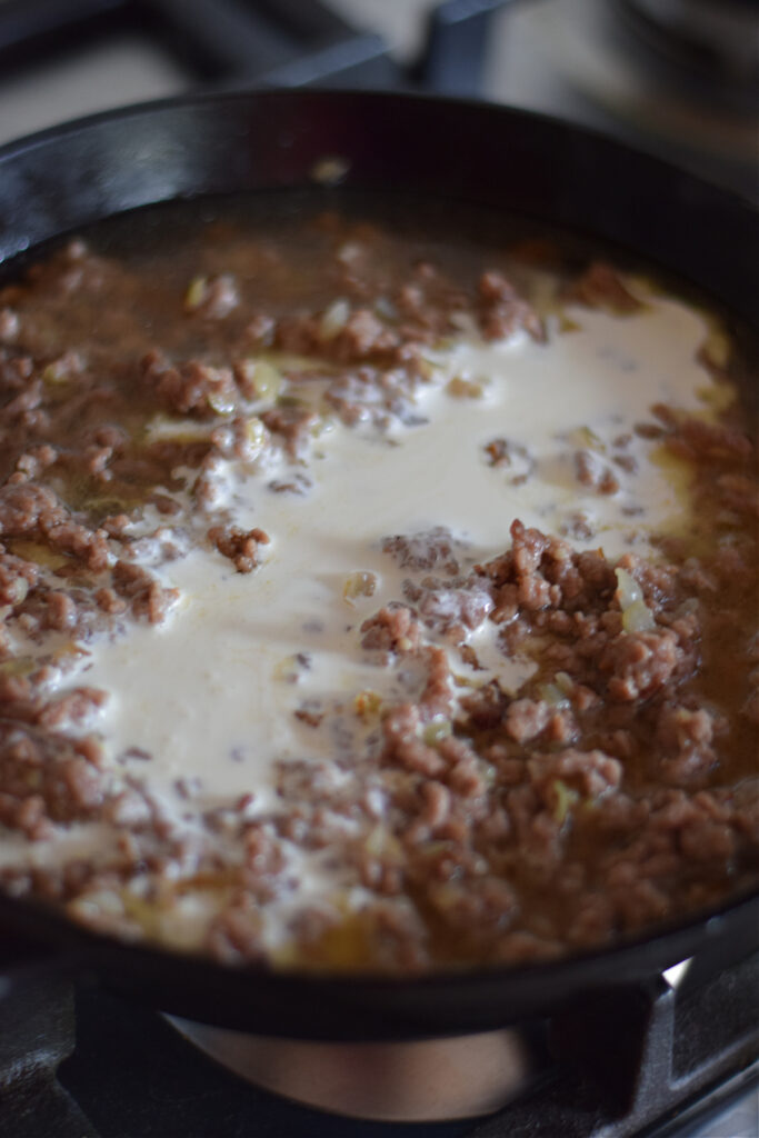 Making ground beef stroganoff.