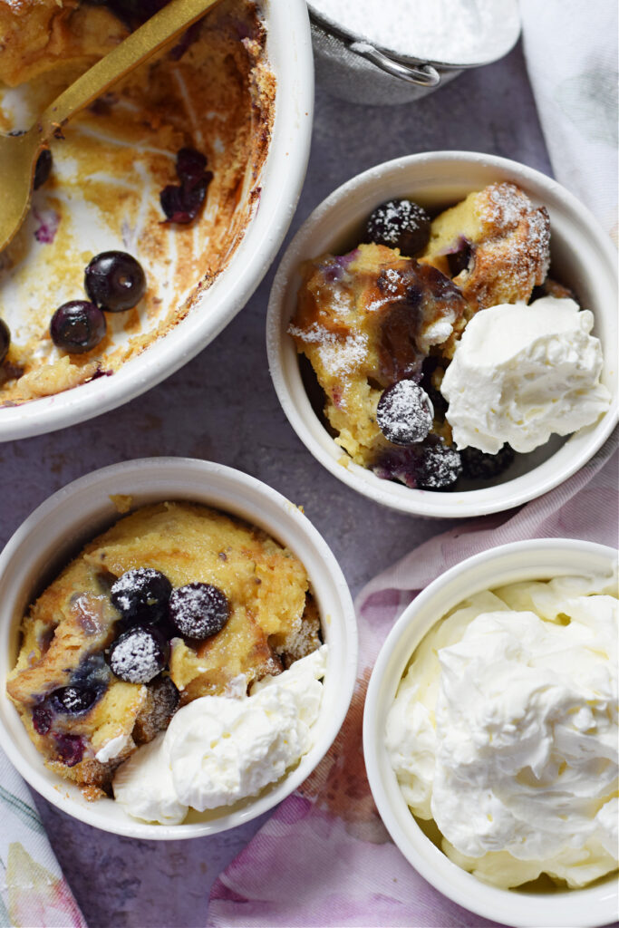 Baked blueberry pudding in serving dishes.