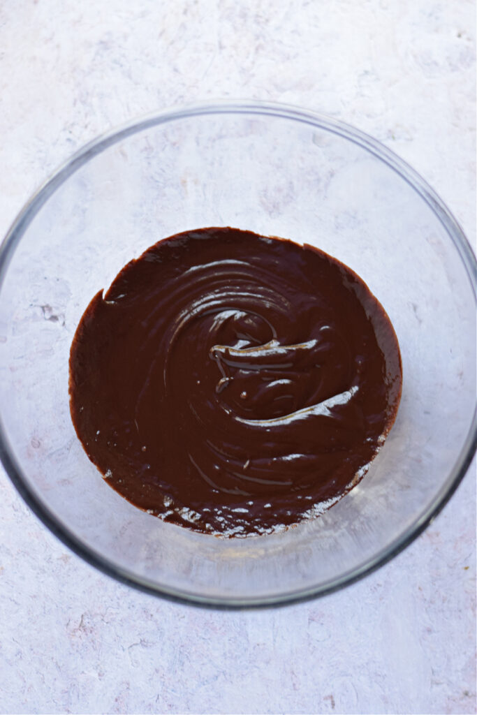 Chocolate ganache in a mixing bowl.