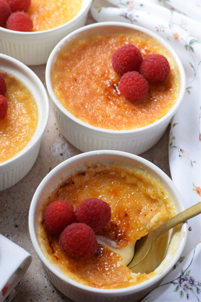 Vanilla creme brulee in white pots.