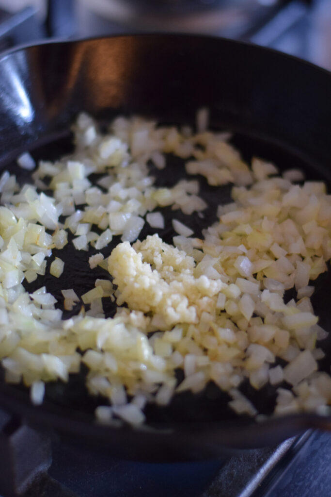 Cooked onion in a skillet.