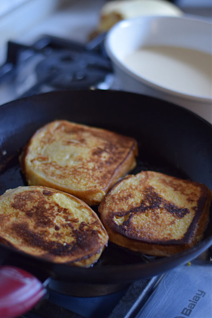 Cooking french toast in a skillet.