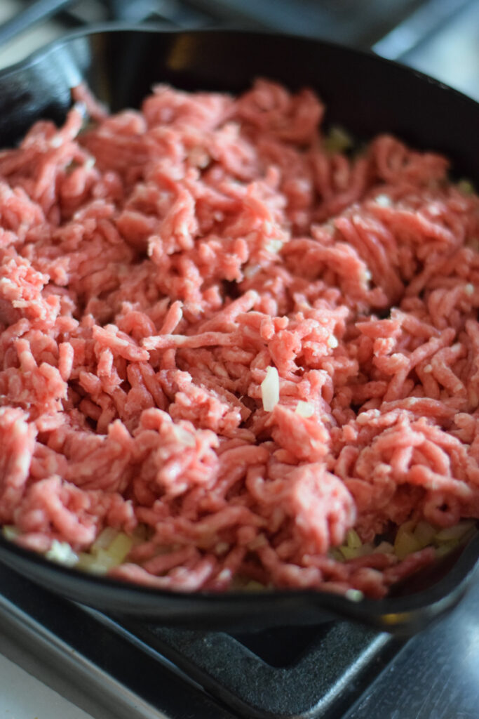 Adding ground beef to a skillet