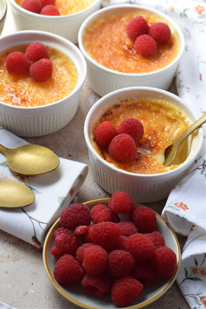 Creme brulee with fresh raspberries.