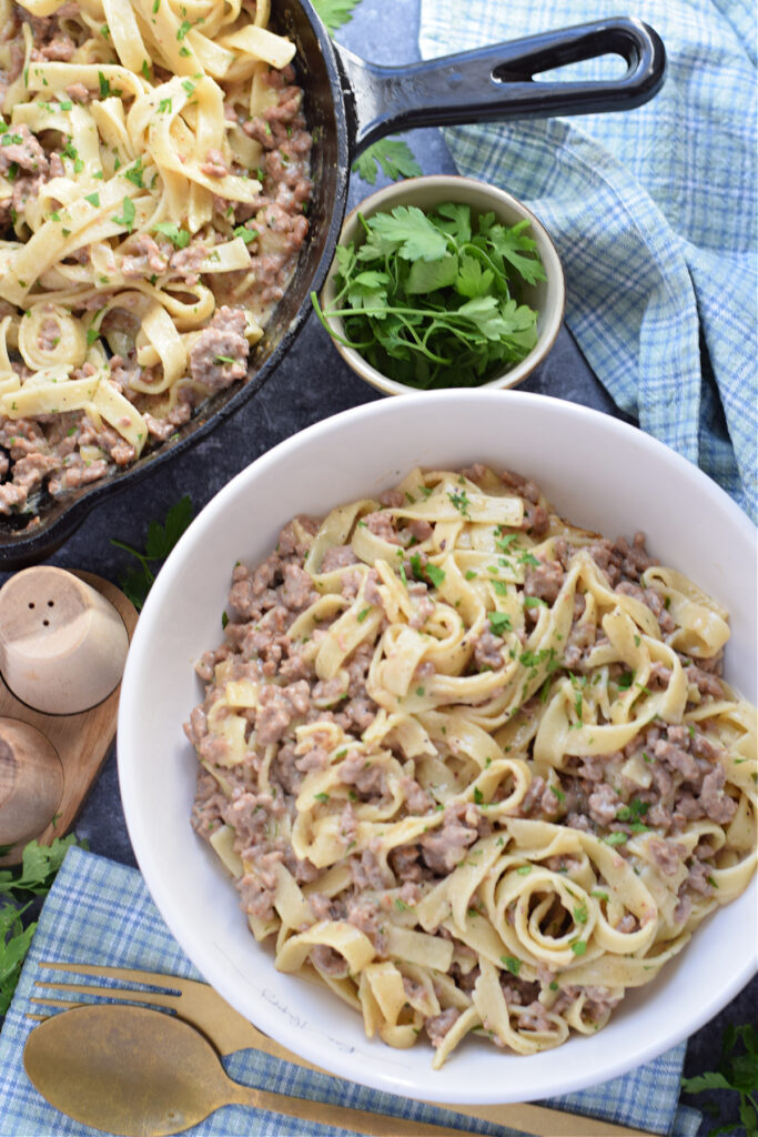 Ground beef stroganoff in a white bowl.