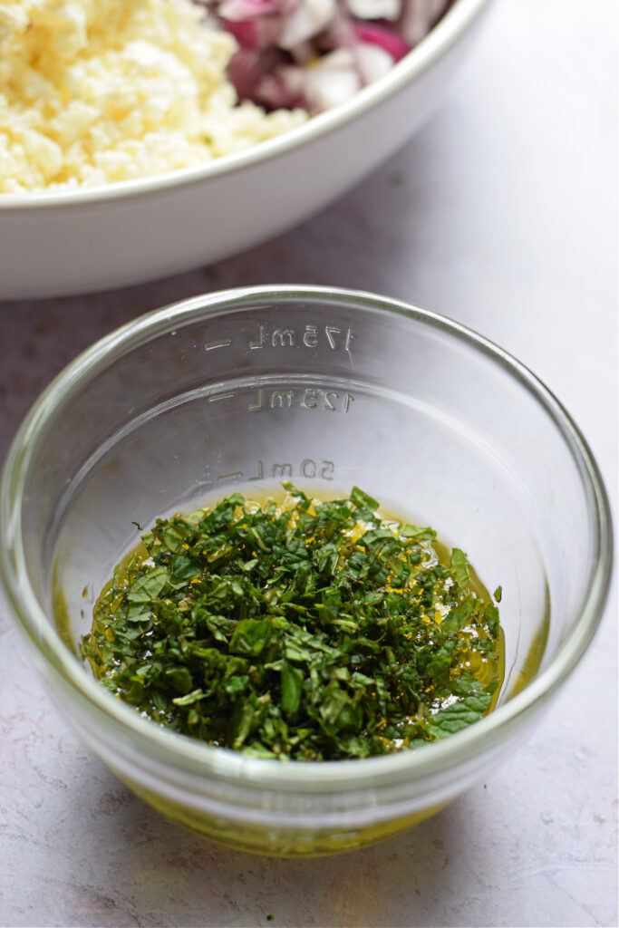 Lemon vinaigrette in a small glass bowl.