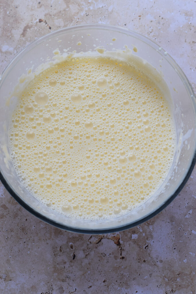 Creme brulee mixture in a mixing bowl.