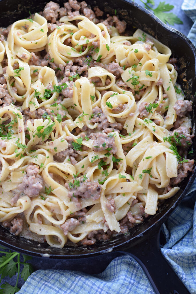 Ground beef stroganoff in a skillet.