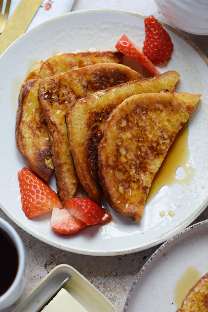 French toast on a plate with berries.