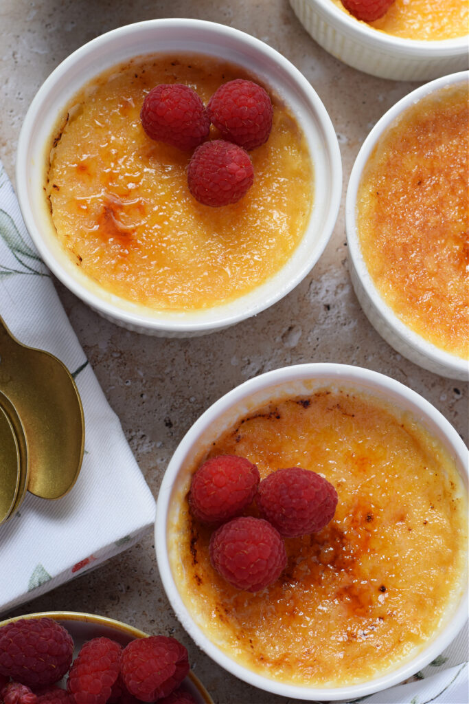 Creme brulee in white serving dishes.