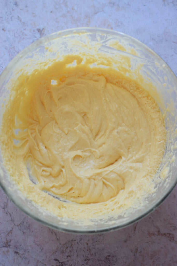 Making cake batter in a glass bowl.