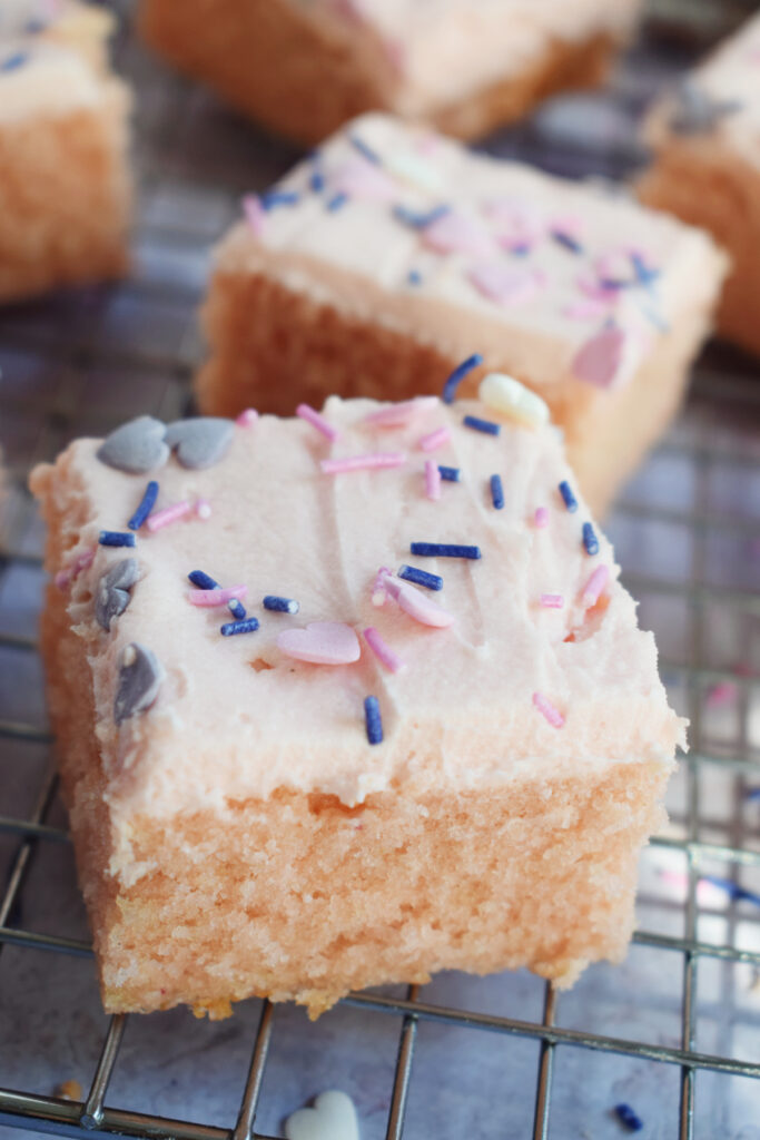 Vanilla cake square on a baking tray.