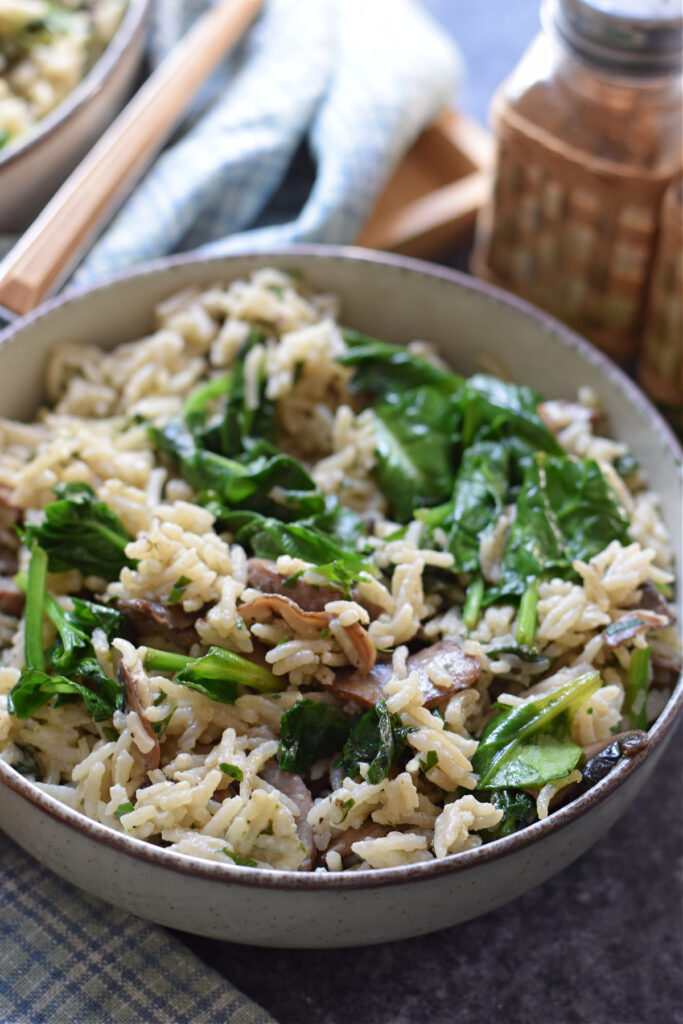 Close up of spinach and mushroom long grain rice.