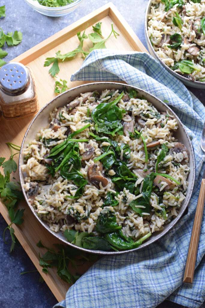 Spinach mushroom rice in a serving bowl.