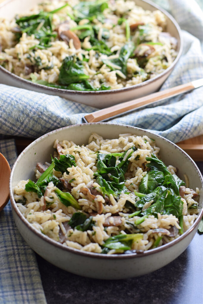 Spinach mushroom rice in a serving bowl.