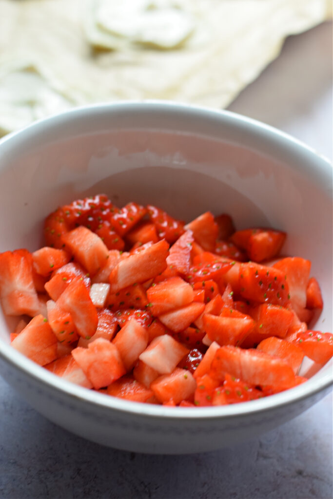 Diced strawberries in a bowl.