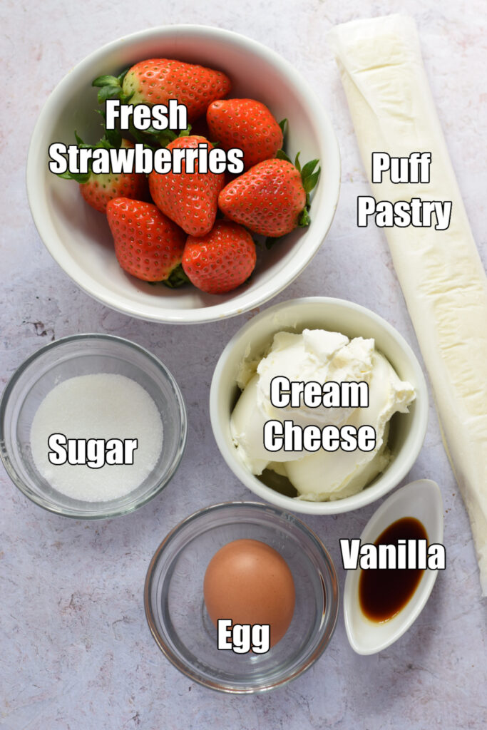 Ingredients to make strawberry cream cheese pastries.