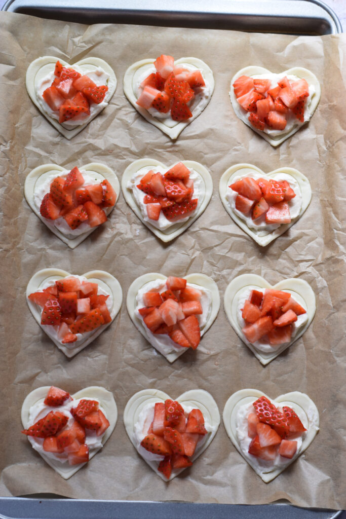 Puff pastry topped with cream cheese and strawberries.