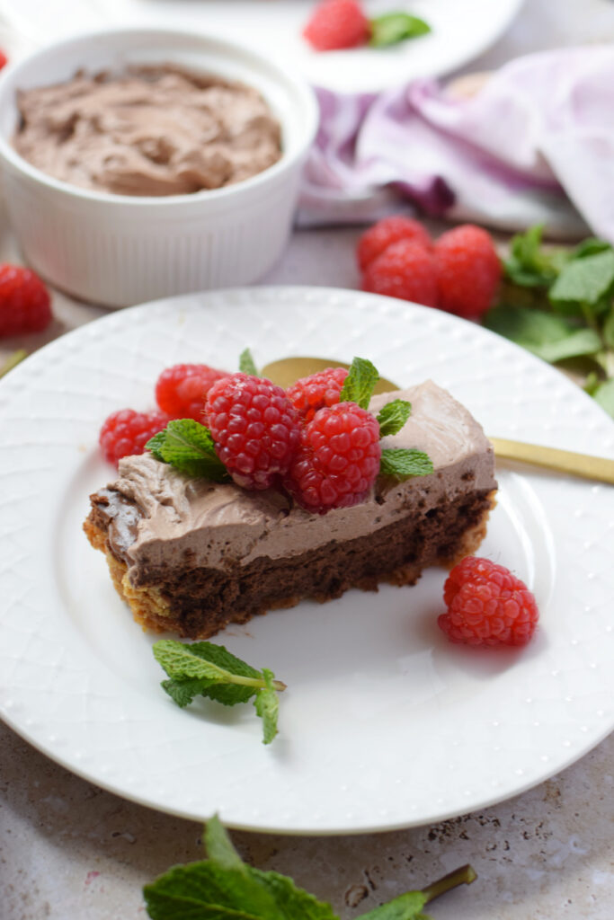 A slice of cheesecake tart on a plate.