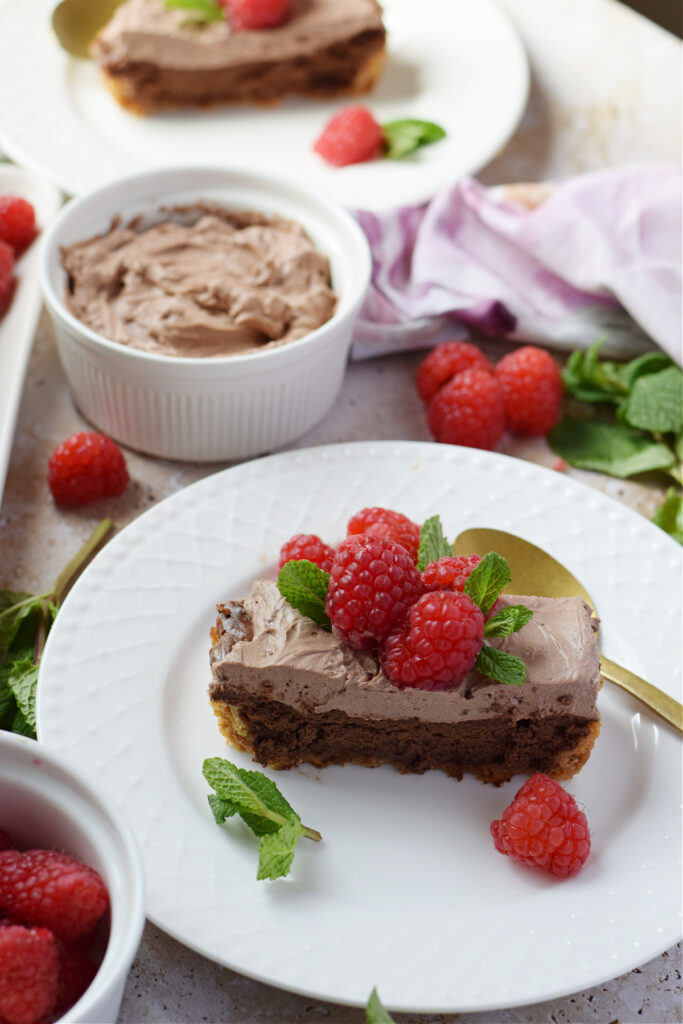 Chocolate cheesecake with raspberries.