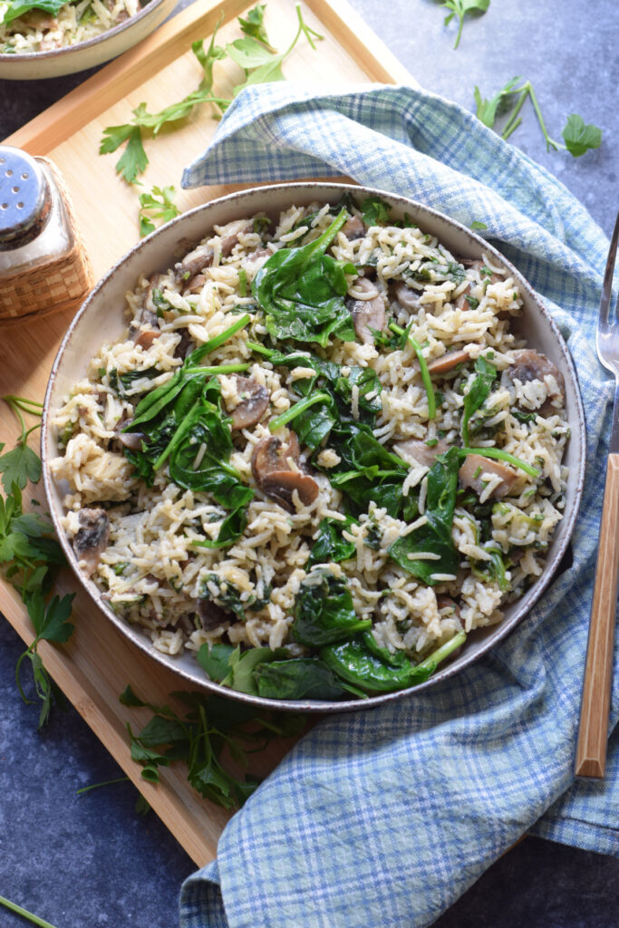 Spinach mushroom rice in a bowl.