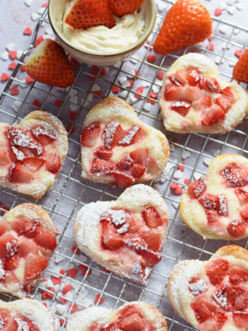 Heart shaped strawberry cream cheese pastries.