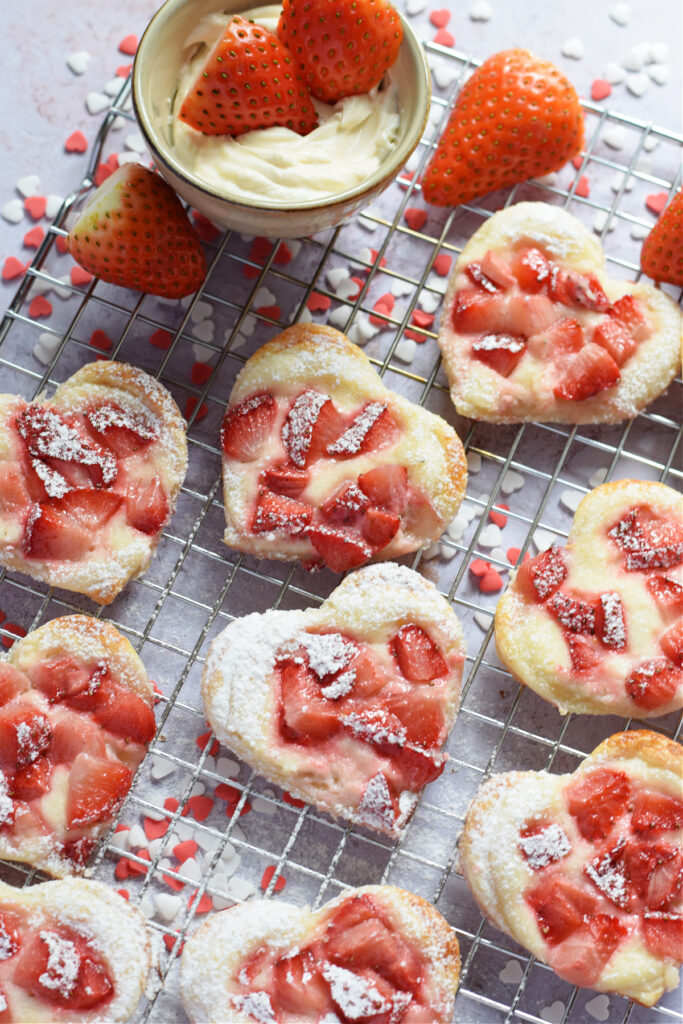 Heart shaped strawberry cream cheese pastries.