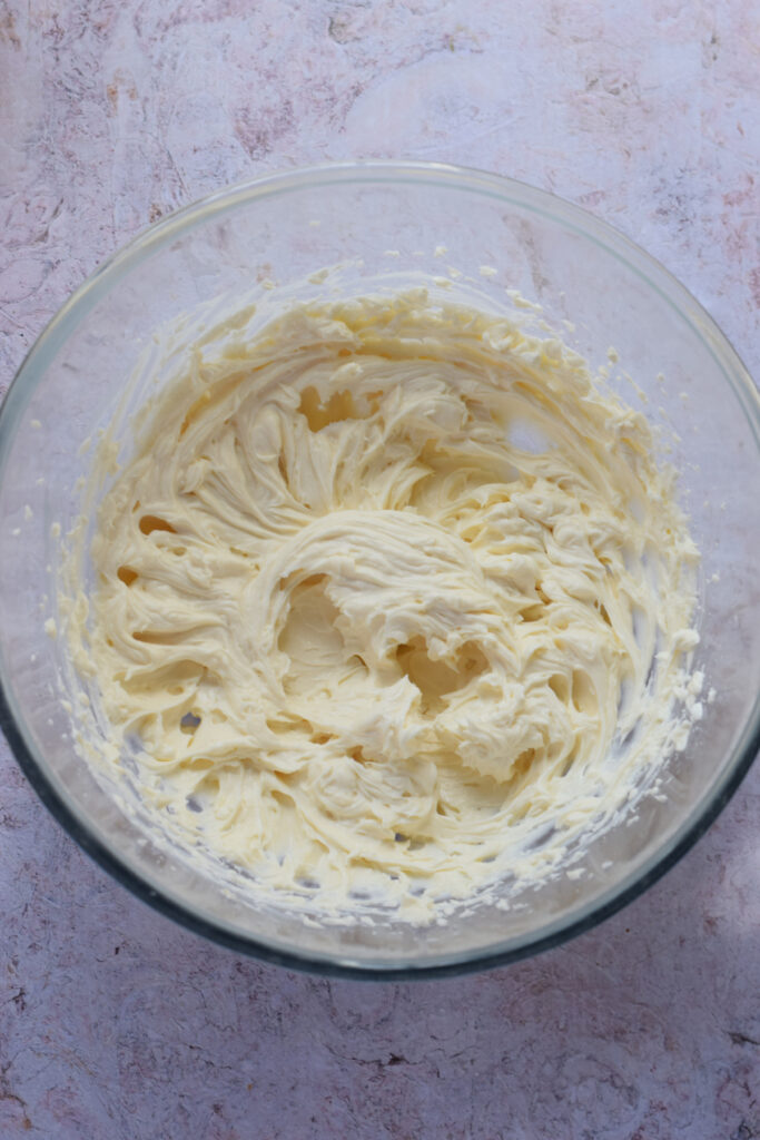 Cream cheese filling in a glass bowl.