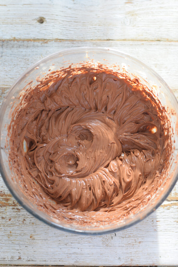 Chocolate cream cheese mixture in a bowl.