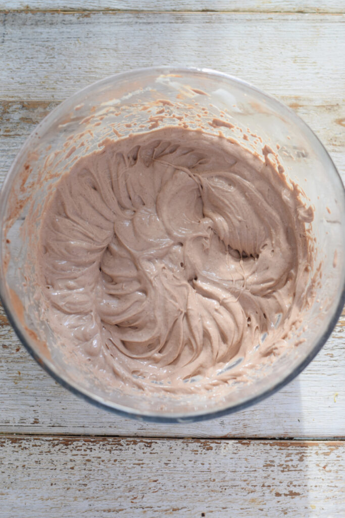 Whipped chocolate cream cheese mixture in a bowl.