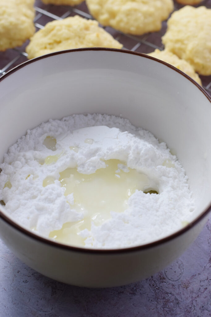 Making a sugar glaze in a bowl.