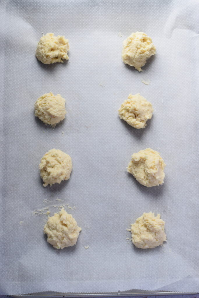 Ready to bake cookies on a baking sheet.