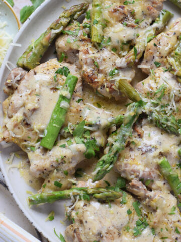 Close up of lemon chicken and asparagus.