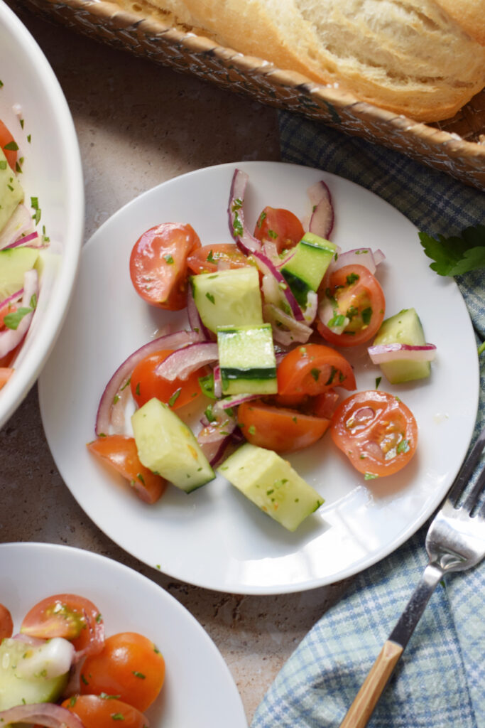 Fresh salad on a white plate.