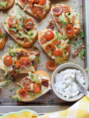 Bruschetta on a tray with a cream cheese spread.