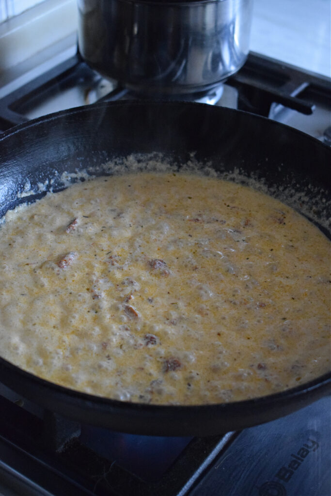 Making a sun dried tomato sauce.