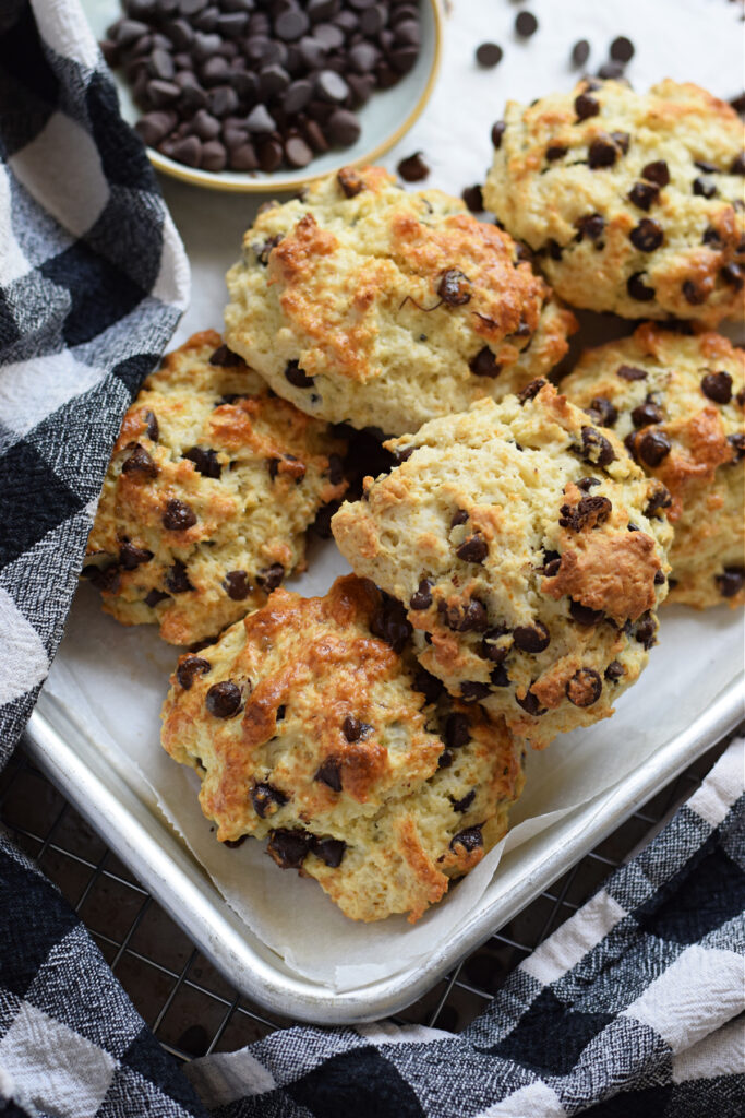 Chocolate chip scones on a white plate.