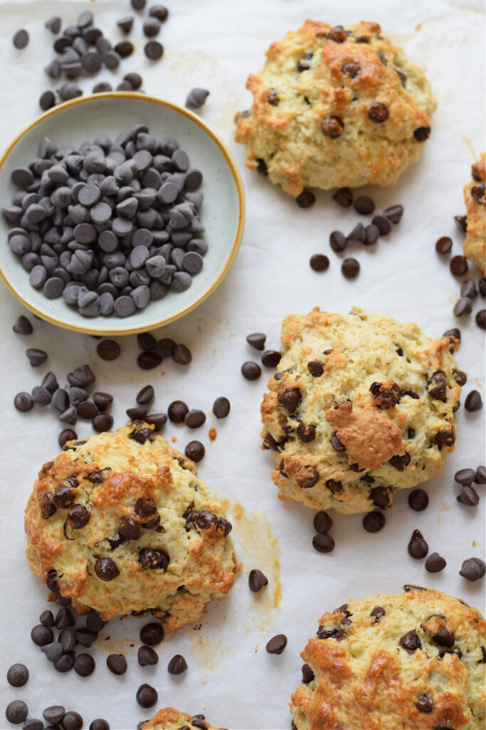 Chocolate chip scones on a baking tray.